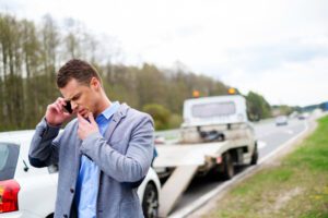 Man calls San Diego lawyer while car is towed away from truck accident scene