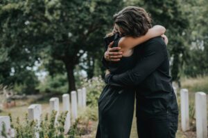 A grieving couple. Find out how a Riverside wrongful death lawyer can help your family.