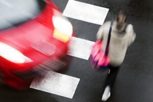 A negligent driver is about to hit a woman crossing the street. A pedestrian accident lawyer in San Jose Will help the injured victim hold the reckless driver accountable.