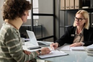 An injured woman meets with a San Diego premises liability lawyer.