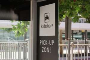 A rideshare sign at an airport. A Lyft collision attorney can help Fresno, CA, victims sue for damages after an accident.