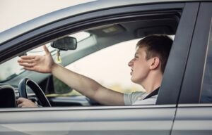 A male driver is frustrated after an Uber driver caused an accident and was liable.