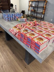 Omega Law Group and PATH included essential and comfort food items in the meal kit donations for the holidays.