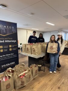 The Omega Law Group team and PATH Los Angeles donate meal kits for the holidays.
