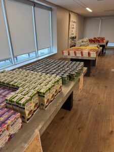 In West Carson at the Meal Kit Giveaway, tables were stacked with food.